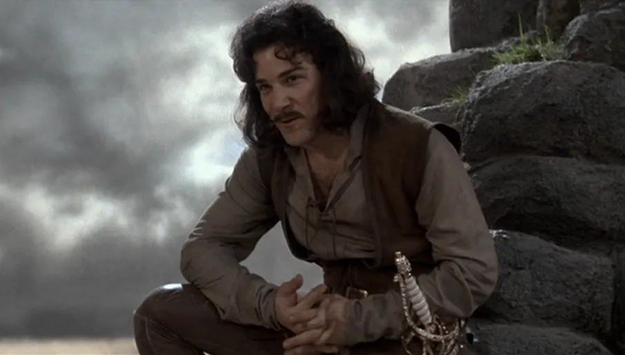 Swordsman kneeling on a rocky hillside under a stormy sky